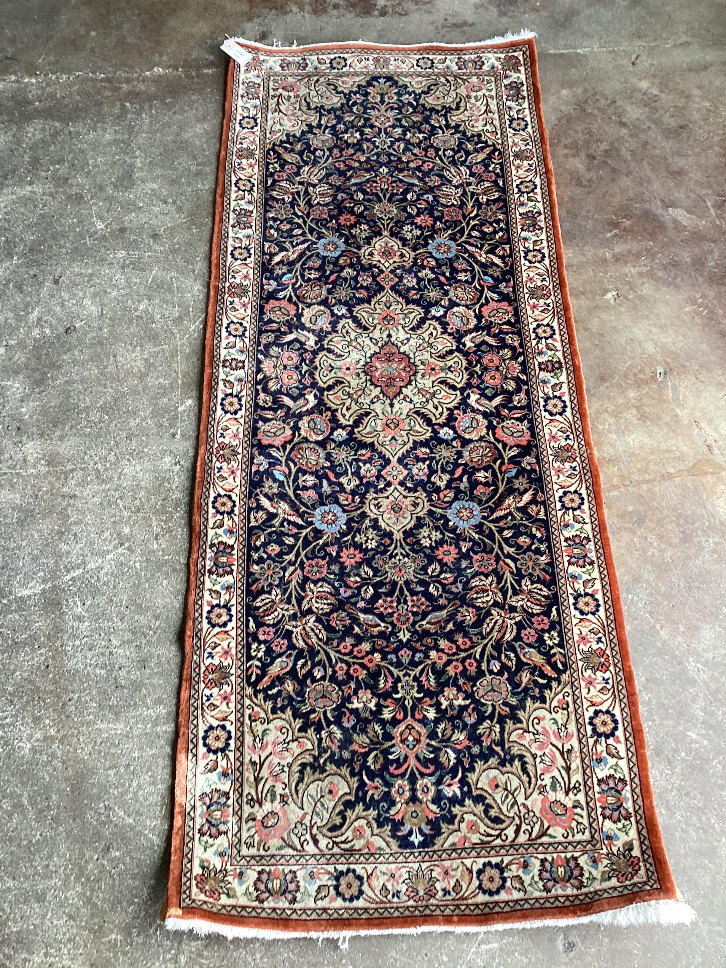 A modern Persian dark blue ground runner, 185 x 70cms